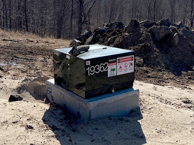 Rural transformer and service equipment on concrete pad